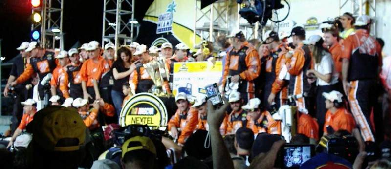 Tony Stewart collects his big check