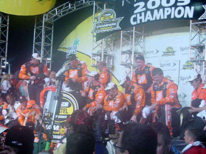 Tony Stewart and his team celebrate winning the Nextel Cup