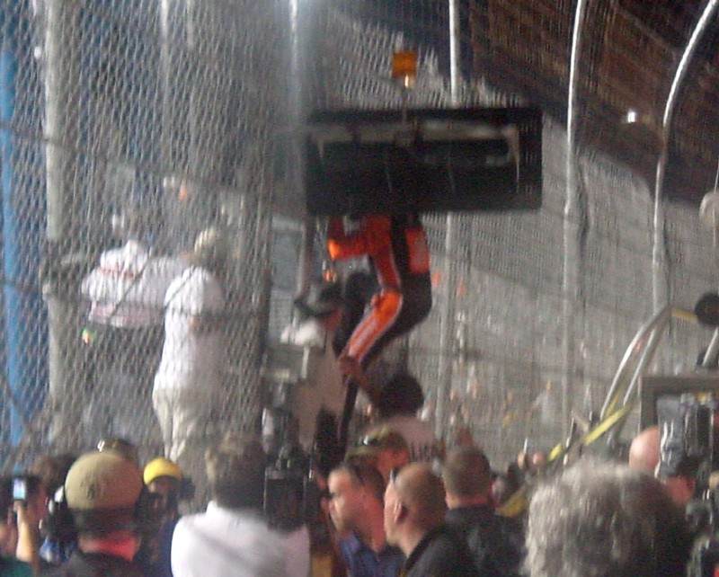 Tony Stewart climbing the fence for the SpeedChannel folks.